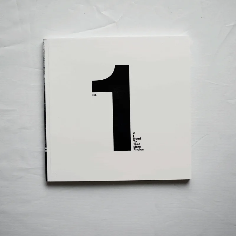 insta_book_stack A white paperback cover with a large black number "1" and small text.
